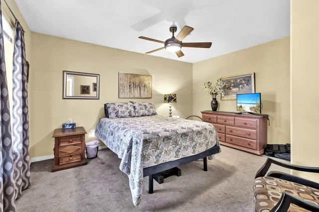 a bedroom with a bed and dresser