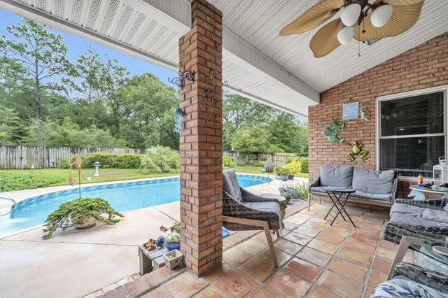a view of a house with swimming pool and porch