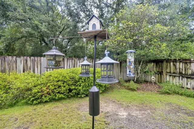 a view of a patio with a table and chairs