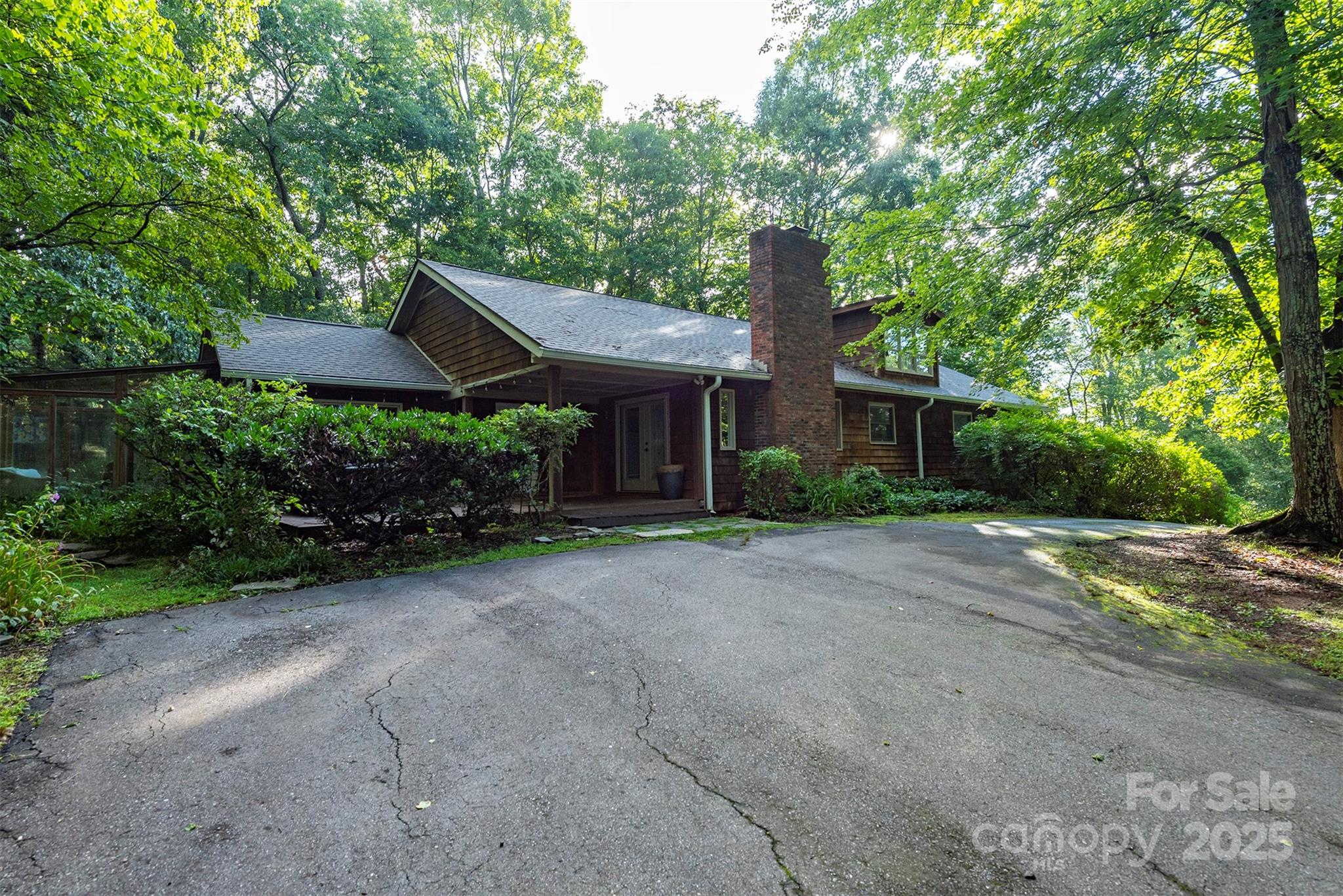269 Newfound Road Leicester, NC 28748 - Photo 1 of 35 a front view of a house with a garden