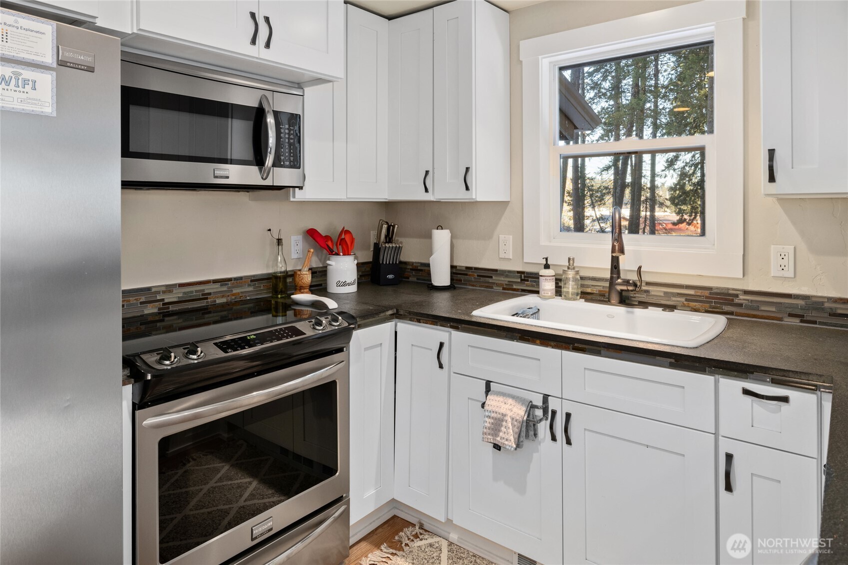 661 Pacific Avenue Ronald, WA 98940 - Photo 25 of 38 a kitchen with cabinets stainless steel appliances and a window