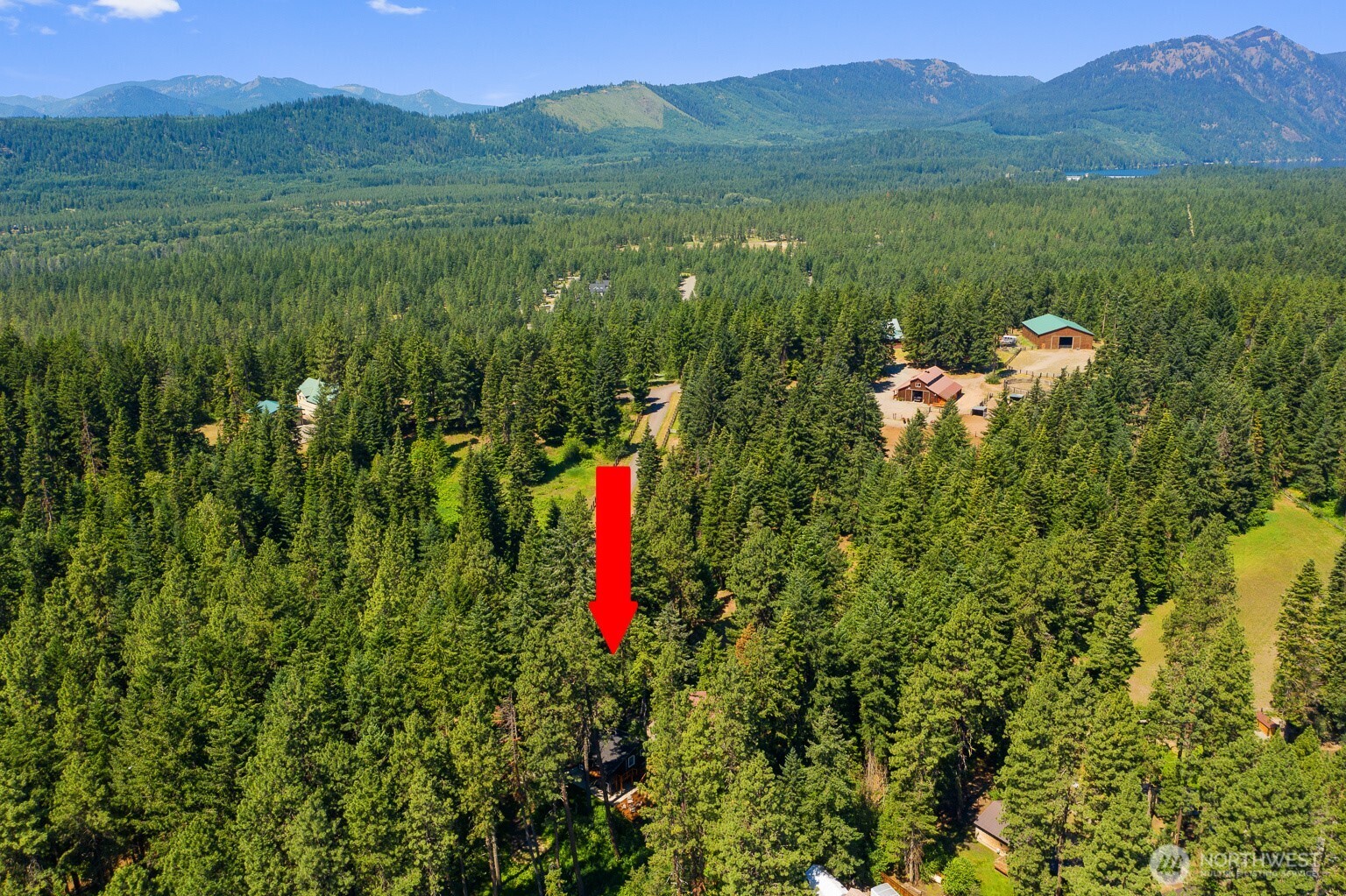 661 Pacific Avenue Ronald, WA 98940 - Photo 7 of 38 a view of a lush green hillside and a houses