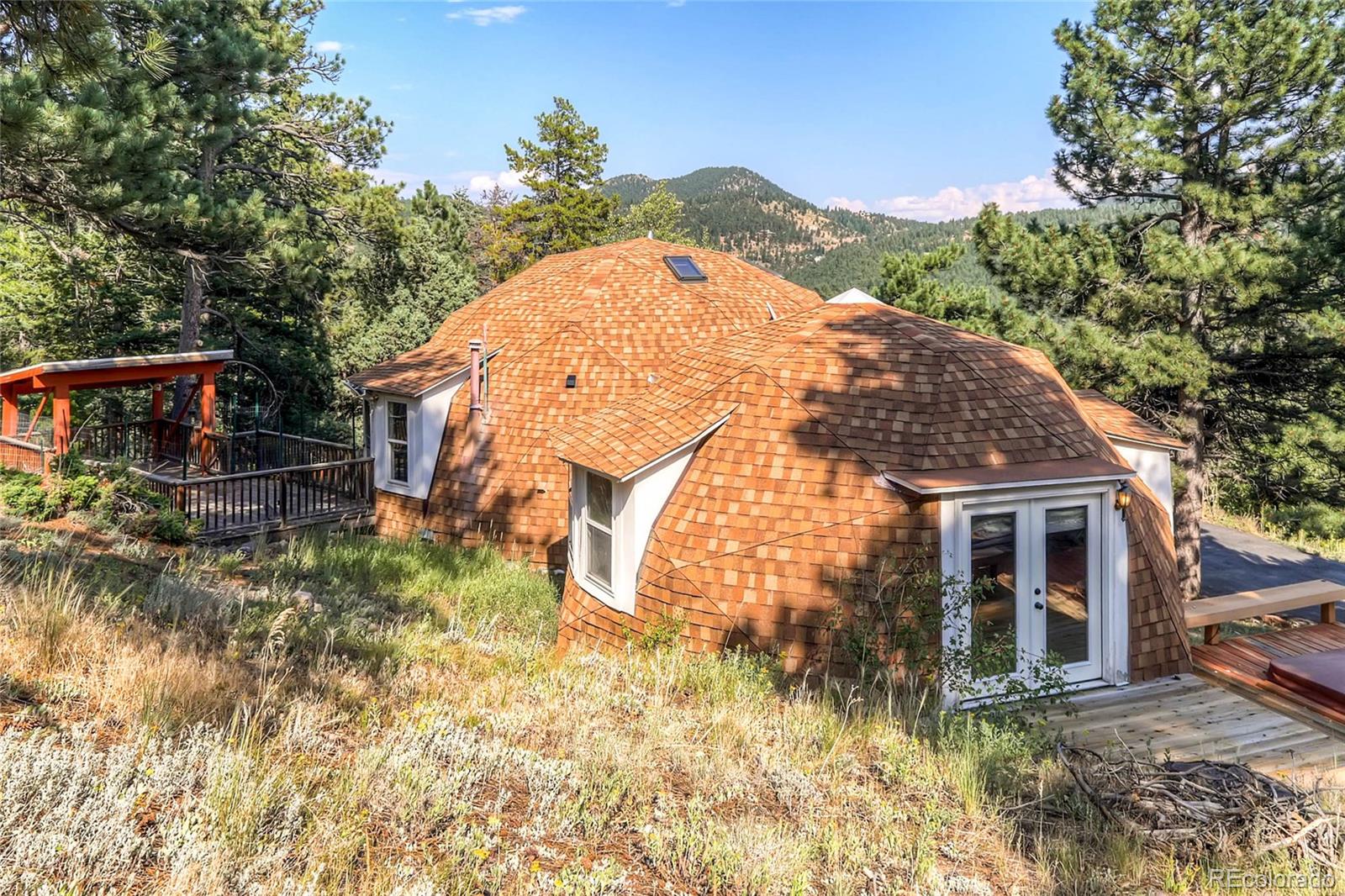 11648 Ranch Elsie Road Golden, CO 80403 - Photo 12 of 13 a view of a house with a yard