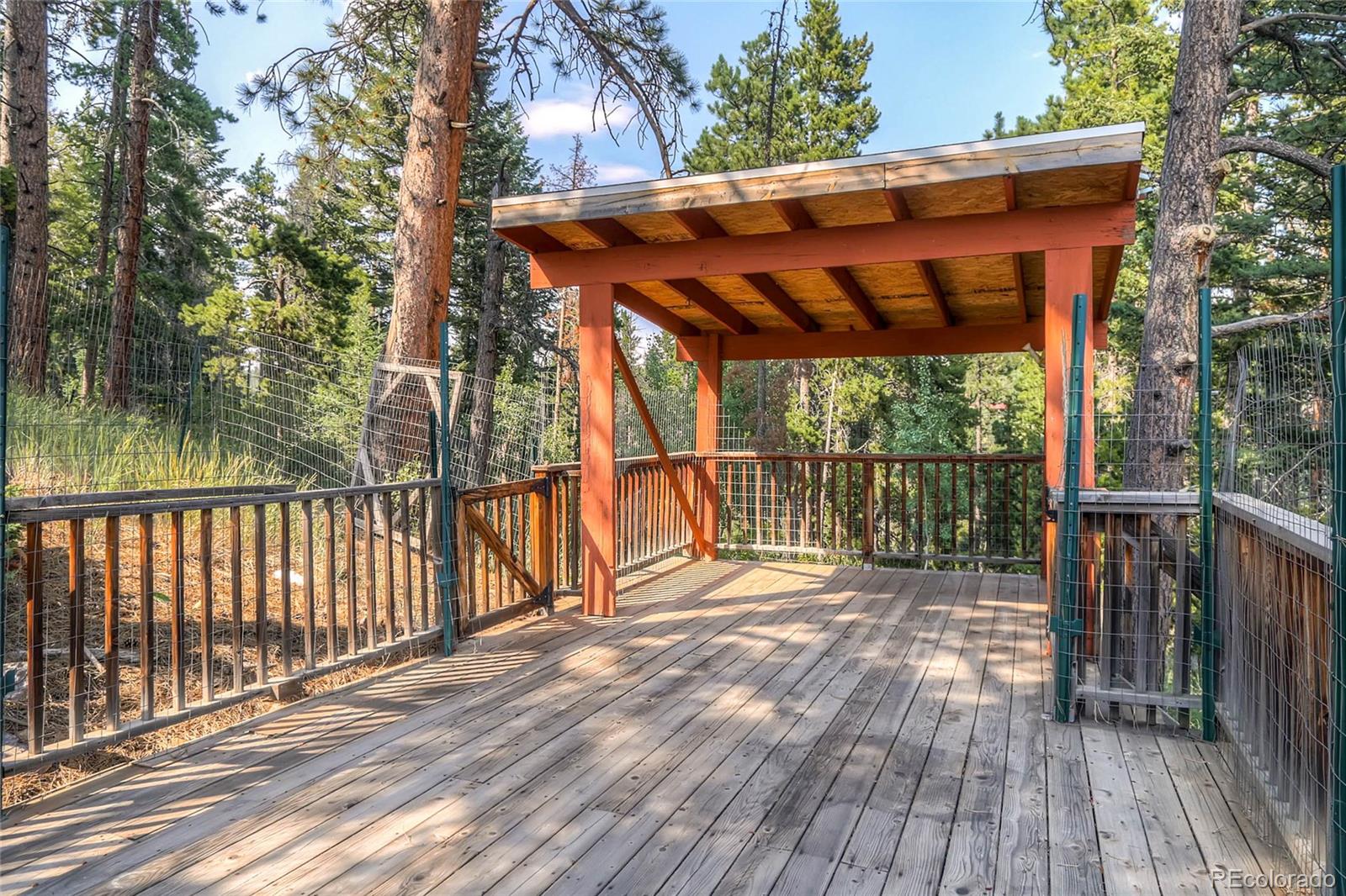 11648 Ranch Elsie Road Golden, CO 80403 - Photo 9 of 13 a view of a wooden deck