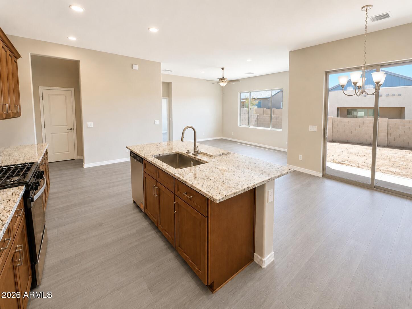 786 Flat Iron Road, Unit LOT 503 Clarkdale, AZ 86324 - Photo 5 of 14 a kitchen with sink cabinets and wooden floor