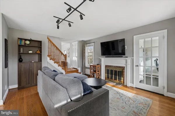 a living room with furniture fireplace and flat screen tv