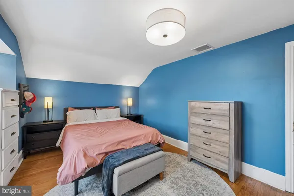 a bedroom with a bed and a closet