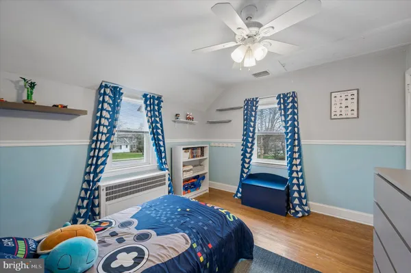 a bedroom with furniture and a chandelier