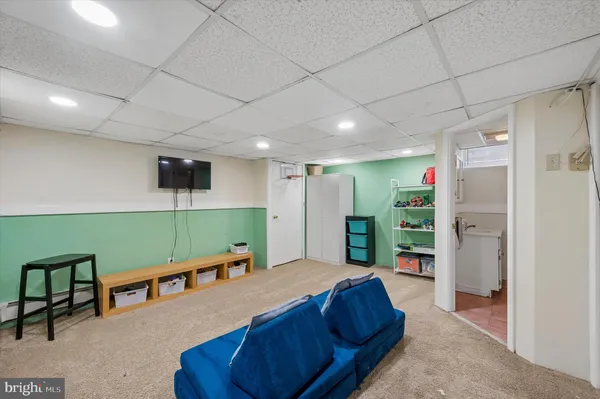 a living room with furniture pool and a table