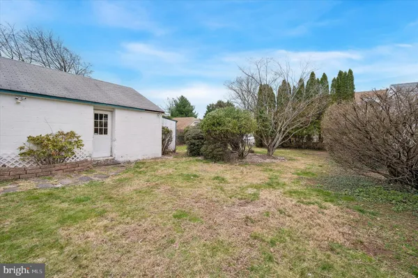 a view of a house with a yard and plants