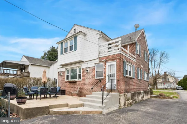 a view of a building with sitting area