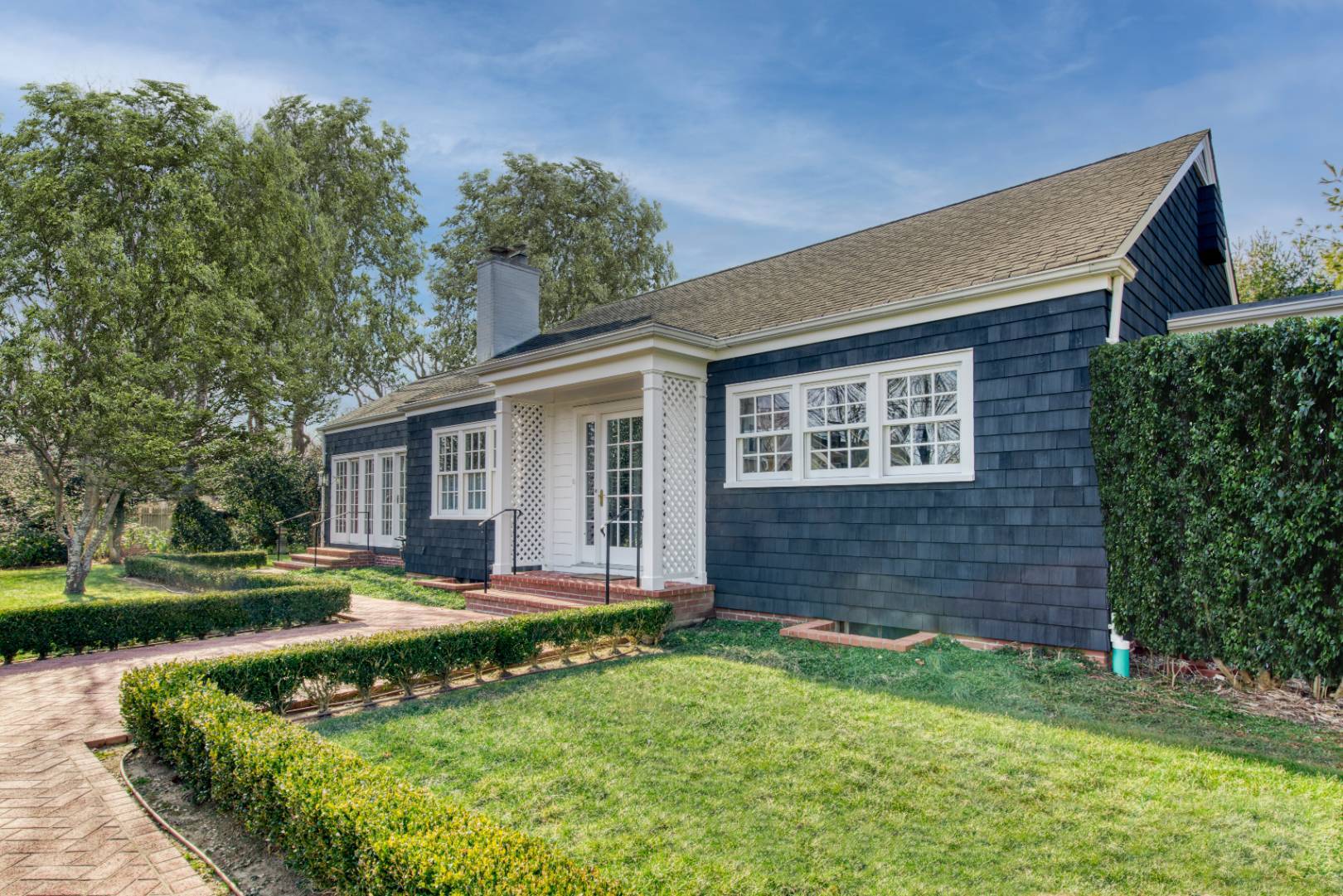 38 Halsey Lane Bridgehampton, NY 11932 - Photo 1 of 15 front view of house with a yard