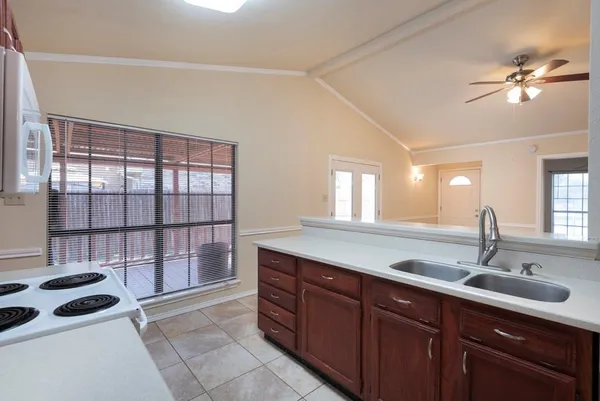 a kitchen with a sink and a window