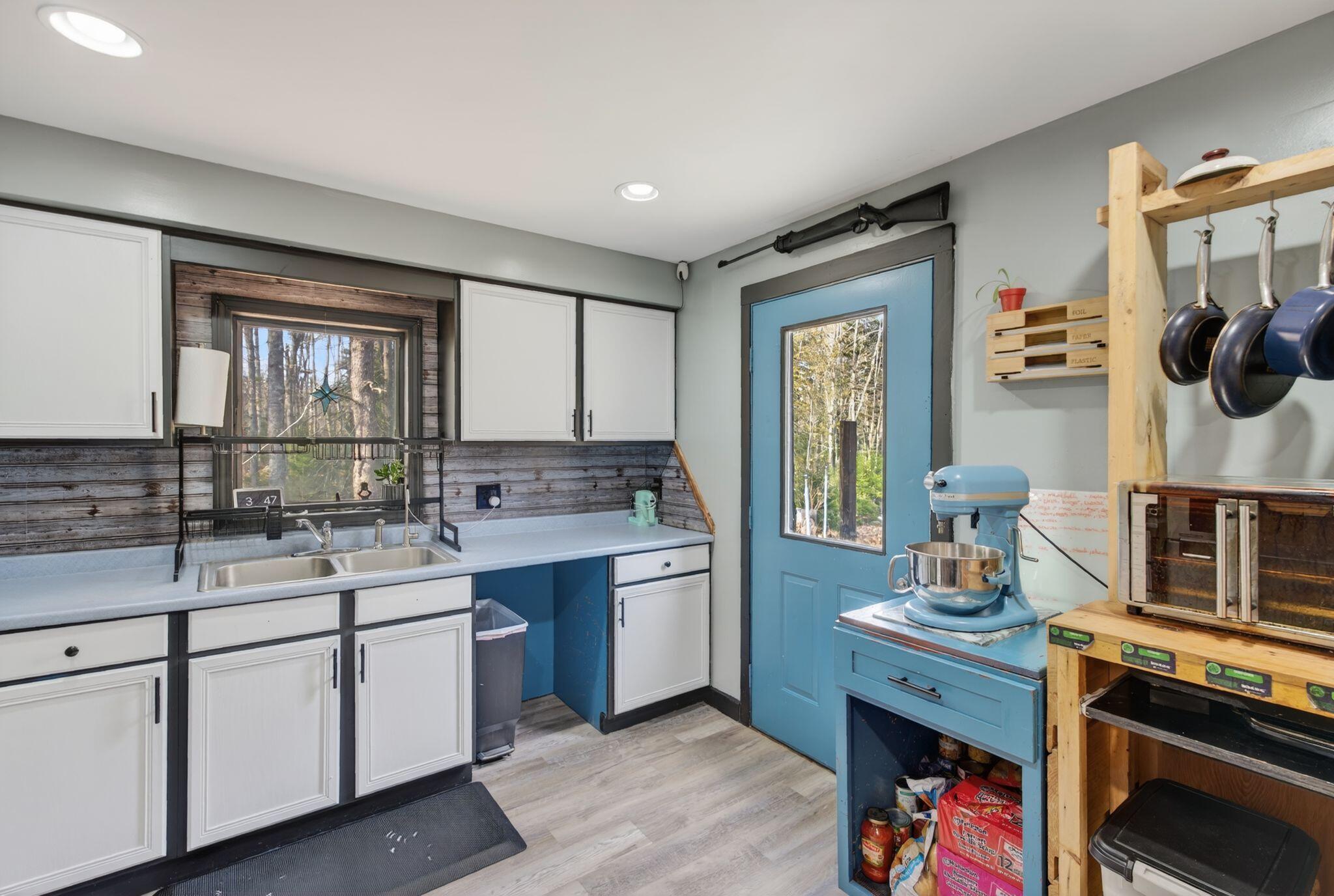 401 Miller Road Waldoboro, ME 04572 - Photo 19 of 36 Kitchen and Exit onto Deck