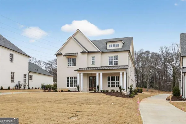 a view of a room with wooden floor and windows