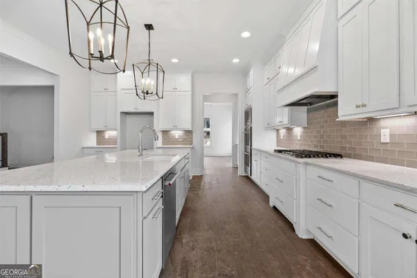 a view of empty room with wooden floor and windows