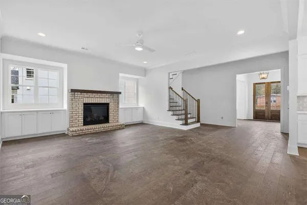 a bathroom with a sink toilet vanity and shower