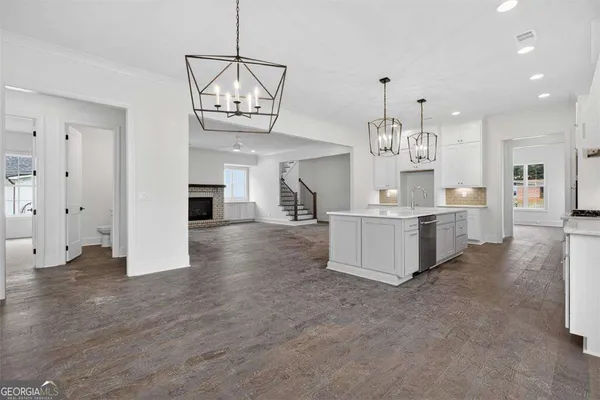 a white bath tub sitting next to a white toilet