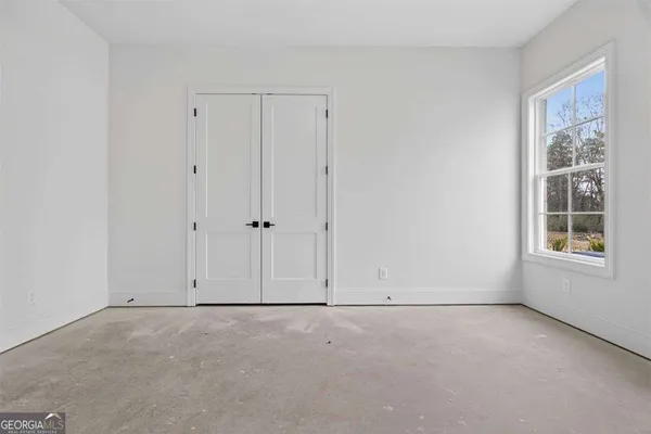 a bathroom with a toilet and a bathtub