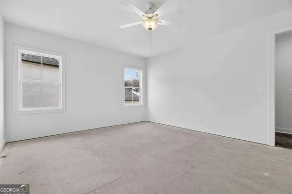 a bathroom with a sink vanity tub and a mirror