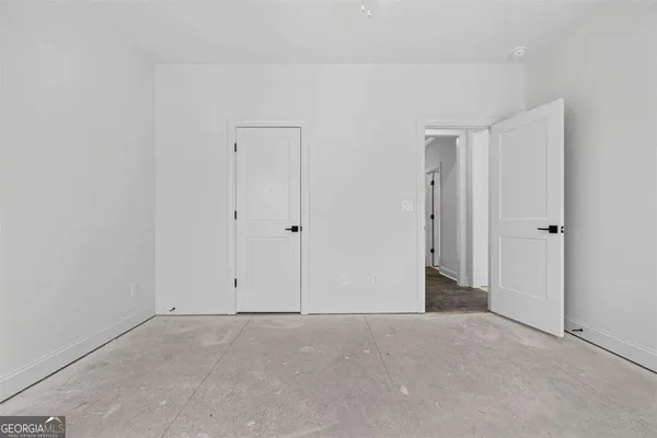 a view of a house with snow on the road