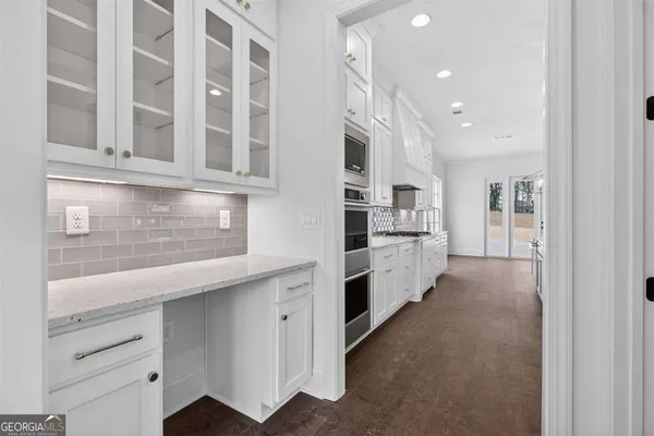 a view of empty room with fireplace