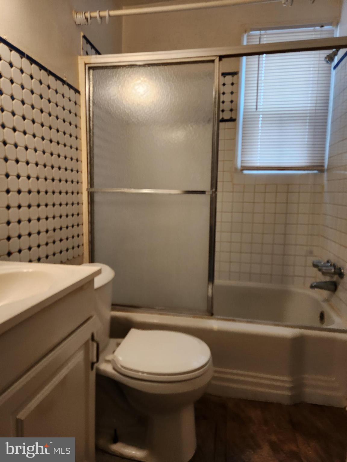 5023 Addison Road Capitol Heights, MD 20743 - Photo 5 of 17 a bathroom with a toilet a sink and shower