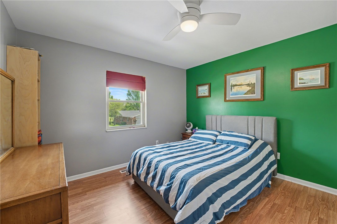 4919 Silver Arrow Drive Riverside, OH 45424 - Photo 26 of 57 This cozy bedroom features durable wood flooring and a refreshing ceiling fan for comfort.