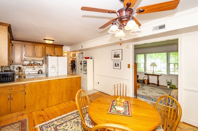 9724 Kendrick Road North Chesterfield, VA 23236 - Photo 16 of 38 a living room with stainless steel appliances furniture a chandelier and a dining table