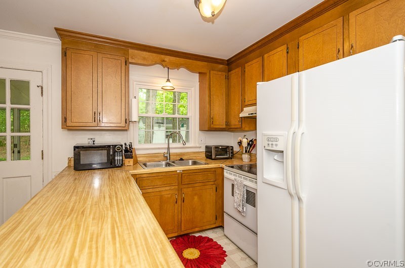 9724 Kendrick Road North Chesterfield, VA 23236 - Photo 18 of 38 a kitchen with a sink a counter top space stainless steel appliances cabinets and a large window