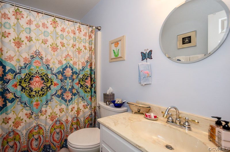 9724 Kendrick Road North Chesterfield, VA 23236 - Photo 25 of 38 a bathroom with a sink toilet and a mirror
