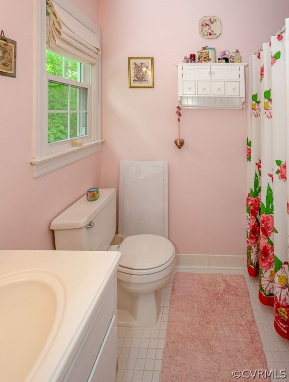 9724 Kendrick Road North Chesterfield, VA 23236 - Photo 29 of 38 a bathroom with a sink a toilet and a shower curtain