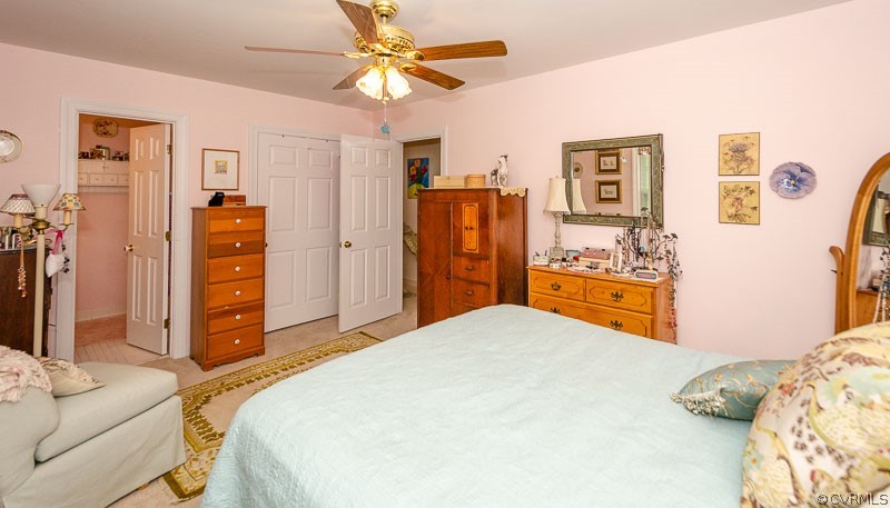 9724 Kendrick Road North Chesterfield, VA 23236 - Photo 30 of 38 a bedroom with a bed and a flat tv screen on dresser