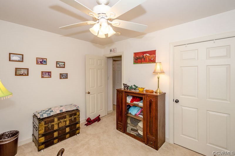 9724 Kendrick Road North Chesterfield, VA 23236 - Photo 32 of 38 a living room with furniture and a baby crib