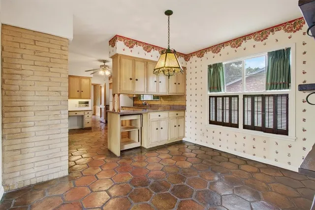 a view of a bathroom with a sink and mirror