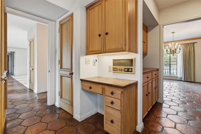 a kitchen with stainless steel appliances granite countertop a stove and a refrigerator