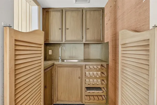 a kitchen with a refrigerator and a stove