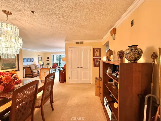 a living room with furniture a rug and a window