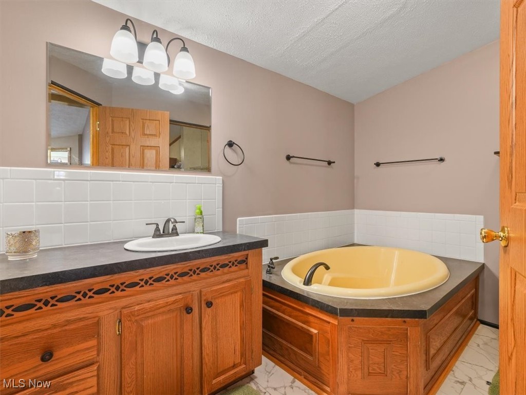 750 Webster Road Jefferson, OH 44047 - Photo 22 of 48 Full Bathroom with soaking tub