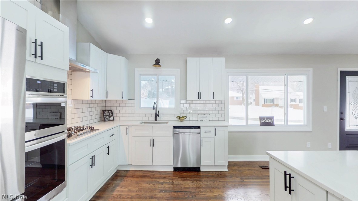 3312 Bancroft Road Akron, OH 44333 - Photo 7 of 50 Kitchen with stainless steel appliances, white cabinets, and recessed lighting