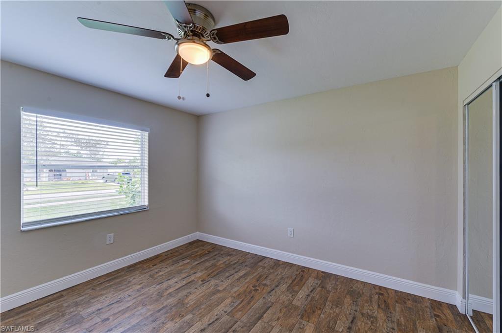 Undisclosed Address Naples, FL 34116 - Photo 10 of 18 an empty room with a window and a fan