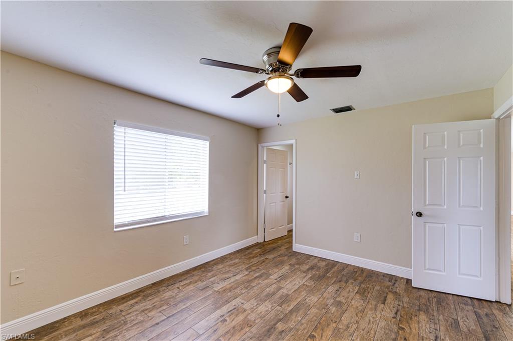 Undisclosed Address Naples, FL 34116 - Photo 14 of 18 a view of a room with a ceiling fan and wooden floor