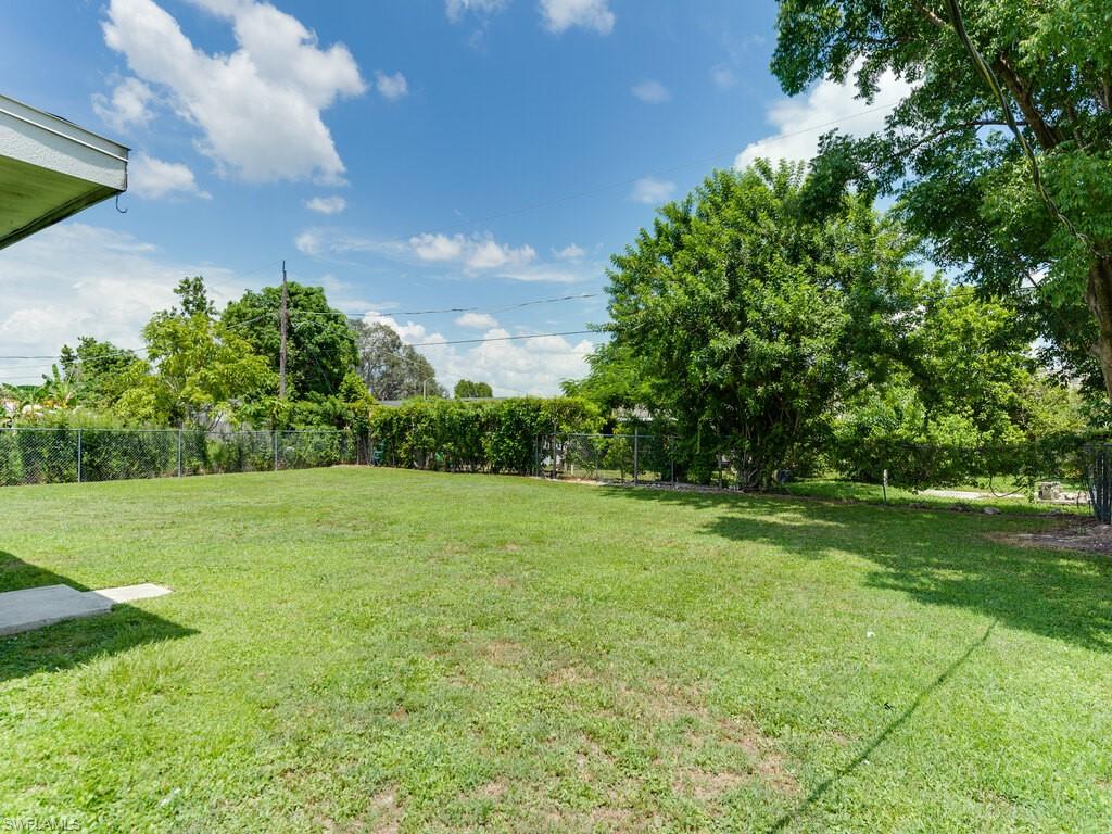 Undisclosed Address Naples, FL 34116 - Photo 4 of 18 a view of field with tall trees