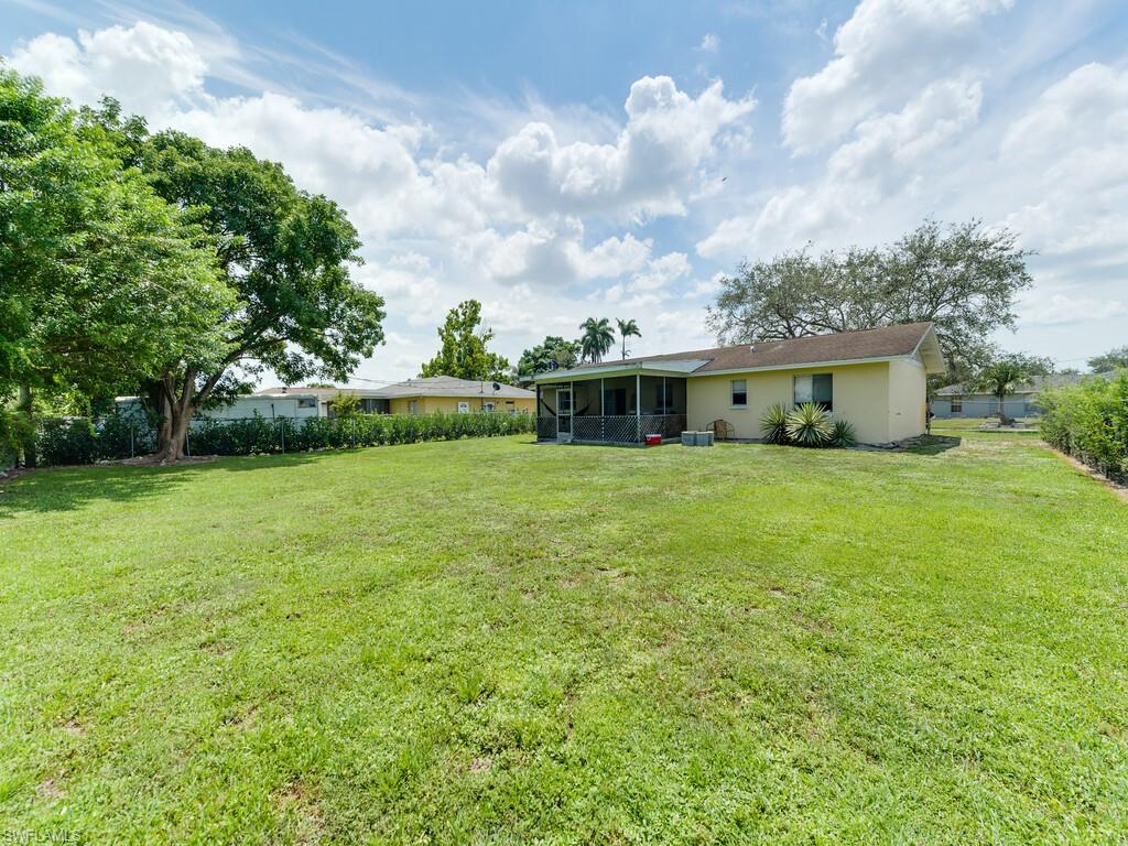Undisclosed Address Naples, FL 34116 - Photo 5 of 18 a view of a house with a yard