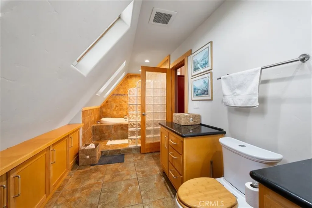 1010 Upper Los Berros Road Nipomo, CA 93444 - Photo 28 of 68 a bathroom with a granite countertop toilet sink and mirror