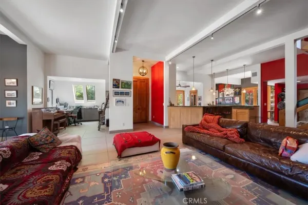 a kitchen with stainless steel appliances granite countertop a sink and a refrigerator