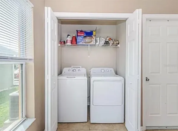 a utility room with dryer and washer
