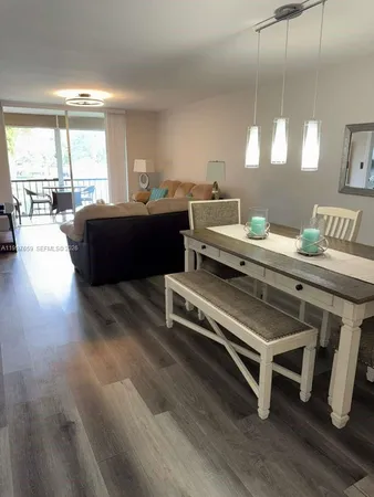 a bedroom with furniture and a large window