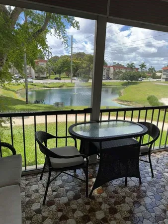 a view of a chairs and table in patio