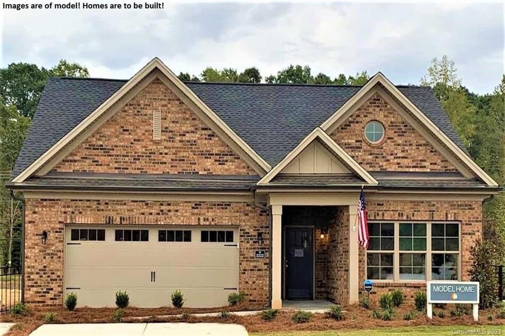 2004 New Style Way, Unit 7 Tega Cay, SC 29708 - Photo 1 of 2 a front view of a house with glass windows